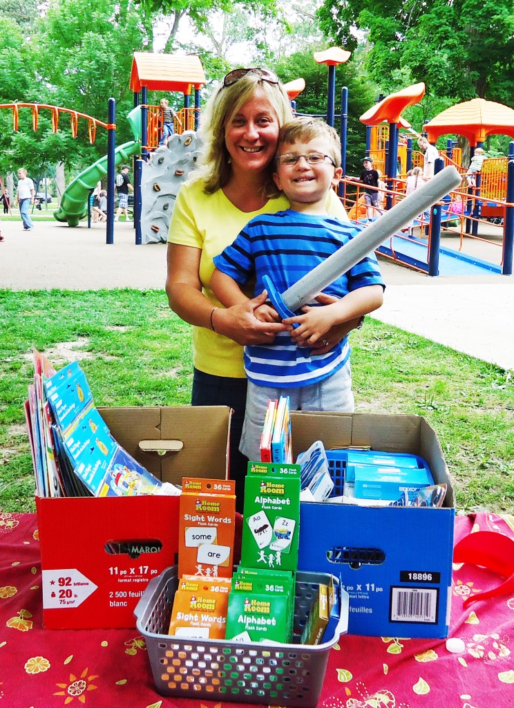 Carolyn Gec and her son donate school suppplies for CHW